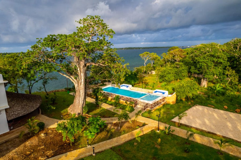 Aerial view of Kasa Pomboo's clifftop pool overlooking the Wasini Channel
