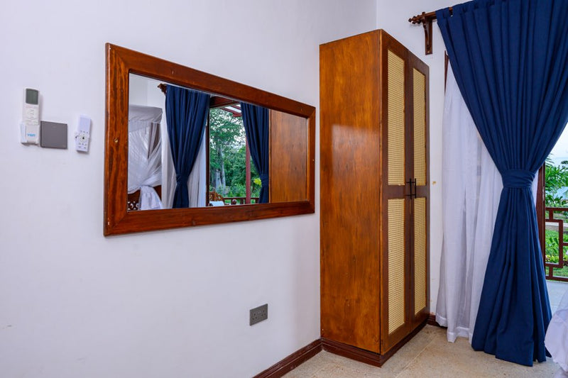 Wardrobe and mirror in a Kasa Pomboo guest room